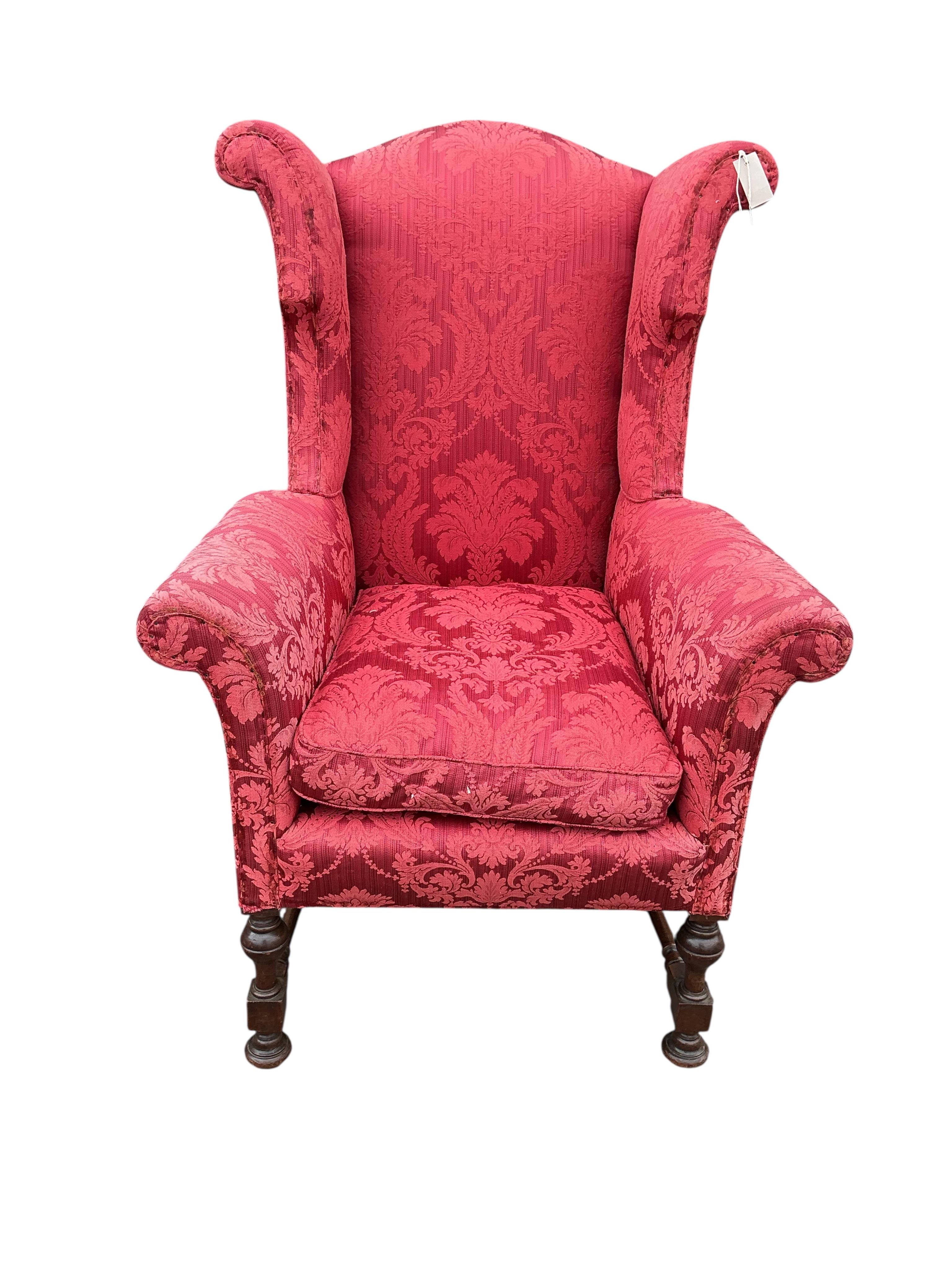 A pair of early 20th century Jacobean Revival upholstered wing armchairs, width 81cm, depth 75cm, height 127cm